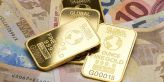 Cena zlata je po útoku na Ukrajinu na více než ročním maximu 1940 USD